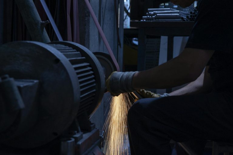 Man Grinding A metal 