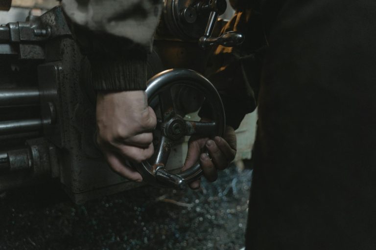 Person Holding Black and Silver Car Steering Wheel